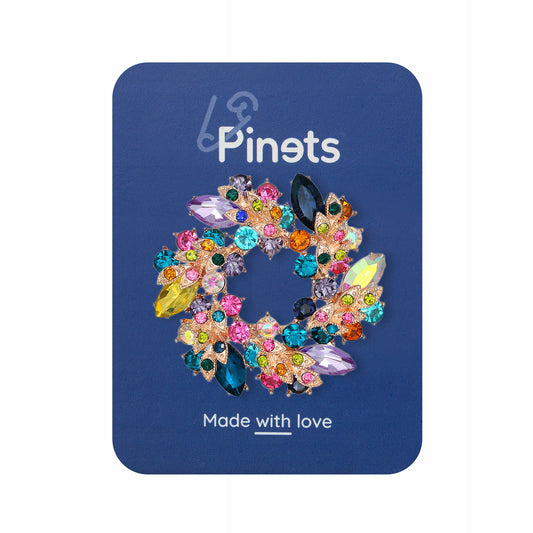 Coroană cu zirconii colorate - o broșă pentru un cadou