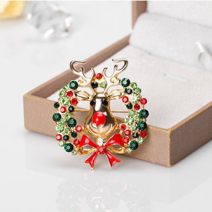 Ren cu o coroană - broșă de Crăciun