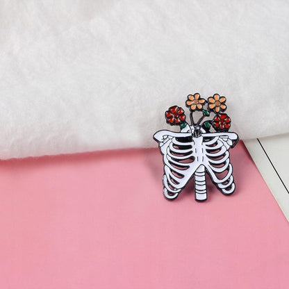 Szkielet z kwiatami przypinka - Pinets Polska
