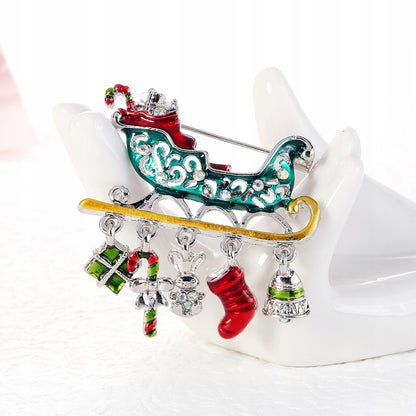 Sania lui Moș Crăciun cu cadouri - broșă de Crăciun