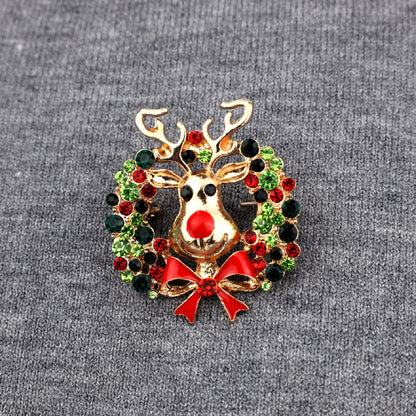 Ren cu o coroană - broșă de Crăciun